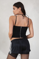 GINAH Solid Low-Rise Sport Shorts 
Elasticated Waistband With Connected Lace Tie 
White Side Straps 
Black Double Lined Nylon Fabric 