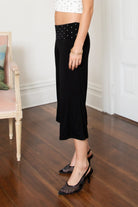 Woman wearing TIC TOC PH31998 SORA rayon fold over waist wide capri leggings featuring a soft lightweight stretch fabric, fold-over waistband with polka dot contrast detail, easy pull-on fit, and relaxed wide leg capri silhouette for a clean lounge and active-inspired everyday look.