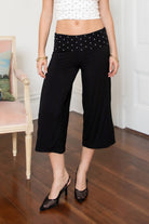 Woman wearing TIC TOC PH31998 SORA rayon fold over waist wide capri leggings featuring a soft lightweight stretch fabric, fold-over waistband with polka dot contrast detail, easy pull-on fit, and relaxed wide leg capri silhouette for a clean lounge and active-inspired everyday look.