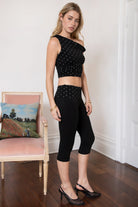 Woman wearing TIC TOC PH31999 SORA rayon fold over waist polka dot capri leggings pants featuring a smooth stretch fabric, contrast polka dot fold-over waistband, mid-rise fit, slim body-hugging silhouette, and clean capri length for a sporty feminine everyday look.
