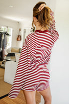 Woman wearing MARLOWE stripe mid waist drawstring stretch shorts featuring an allover stripe pattern, adjustable drawstring waistband, micro shorts length, relaxed easy fit silhouette, and soft stretch jersey fabric for cozy casual lounge styling.