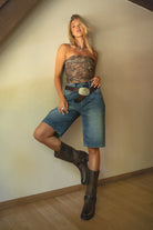TERRI Denim Baggy Dad Skater Jorts 
Low Rise Design With Belt Loop Details 
Zipper Fly Button Closure 
Five Pocket Design 
Distressed Faded Vintage Denim Wash 
Relaxed Below The Knee Fit 
Back To School Western Rodeo Outfit Fashion Inspo
