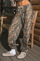 BAYOU Dark Woodland Camo Fleece Lounge Sweatpants
Elasticated Self-Tie Waistband 
Deep Reversible Side Pockets 
Slightly Tapered Ankle Length And  Elastic Cinch Bottom
Dark Forest Woodland Camo
Featured In Our New Cloud Fleece Fabric 
Back To School Western Rodeo Outfit Fashion Inspo

Cloud Fleece Key Features: 
Soft & Lightweight: Gentle on the skin with a breezy feel.
Midweight Warmth: Keeps you comfortable without overheating.
Drapey Design: Flows effortlessly for a flattering, laid-back look
