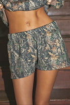 BAYOU Dark Woodland Camo Mid Rise Fleece Shorts 
Relaxed Straight Leg Lounge Fit
Elasticated Waistband 
Deep Reversible Side Pockets 
Dark Forest Woodland Camo
Featured In Our New Cloud Fleece Fabric 
Back To School Western Rodeo Outfit Fashion Inspo

Cloud Fleece Key Features: 
Soft & Lightweight: Gentle on the skin with a breezy feel.
Midweight Warmth: Keeps you comfortable without overheating.
Drapey Design: Flows effortlessly for a flattering, laid-back look

