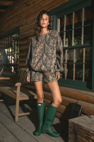 BAYOU Dark Woodland Camo Mid Rise Fleece Shorts 
Relaxed Straight Leg Lounge Fit
Elasticated Waistband 
Deep Reversible Side Pockets 
Dark Forest Woodland Camo
Featured In Our New Cloud Fleece Fabric 
Back To School Western Rodeo Outfit Fashion Inspo

Cloud Fleece Key Features: 
Soft & Lightweight: Gentle on the skin with a breezy feel.
Midweight Warmth: Keeps you comfortable without overheating.
Drapey Design: Flows effortlessly for a flattering, laid-back look
