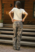 WILDWOOD Low Rise Camo Wood Carpenter Pants 
5 Pocket Denim Styling 
Hammer Loop At Side 
Zipper Button Fly Closure 
Belt Loop Waist
Wide Leg Design 
Contemporary Forest Camo Wood in Green
Quality Camo Twill Low Stretch Fabric
Back To School Western Rodeo Outfit Fashion Inspo