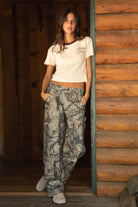 WILDWOOD Low Rise Camo Wood Carpenter Pants 
5 Pocket Denim Styling 
Hammer Loop At Side 
Zipper Button Fly Closure 
Belt Loop Waist
Wide Leg Design 
Contemporary Forest Camo Wood in Green
Quality Camo Twill Low Stretch Fabric
Back To School Western Rodeo Outfit Fashion Inspo