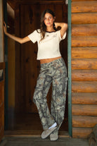 WILDWOOD Low Rise Camo Wood Carpenter Pants 
5 Pocket Denim Styling 
Hammer Loop At Side 
Zipper Button Fly Closure 
Belt Loop Waist
Wide Leg Design 
Contemporary Forest Camo Wood in Green
Quality Camo Twill Low Stretch Fabric
Back To School Western Rodeo Outfit Fashion Inspo