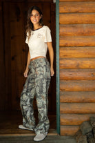 WILDWOOD Low Rise Camo Wood Carpenter Pants 
5 Pocket Denim Styling 
Hammer Loop At Side 
Zipper Button Fly Closure 
Belt Loop Waist
Wide Leg Design 
Contemporary Forest Camo Wood in Green
Quality Camo Twill Low Stretch Fabric
Back To School Western Rodeo Outfit Fashion Inspo