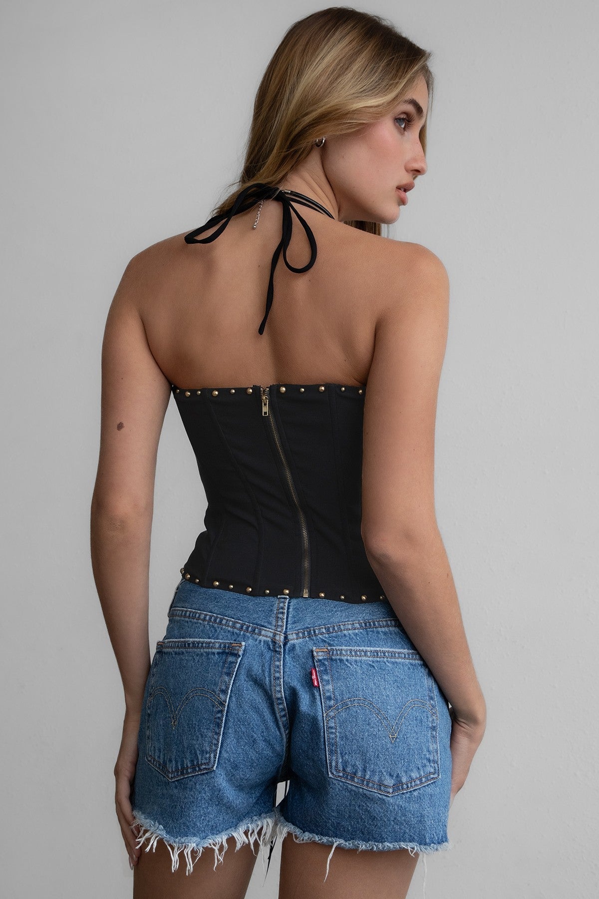 TIC TOC RAELYNN Embroidered Western Corset Top in black with halter tie, lace-up front, and studded detail for a bold western look.