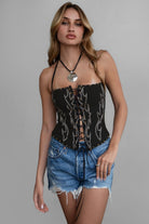 TIC TOC RAELYNN Embroidered Western Corset Top in black with halter tie, lace-up front, and studded detail for a bold western look.