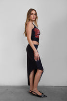 TIC TOC SC30926 MUAH S Mesh Print Asymmetrical Skirt featuring abstract floral mesh design with mid-rise waist and angled hem.