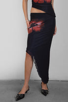 TIC TOC SC30926 MUAH S Mesh Print Asymmetrical Skirt featuring abstract floral mesh design with mid-rise waist and angled hem.