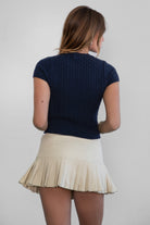 EMMA Low Rise Mini Skort 
Low Rise Sexy Pleated Mini Skirt 
Built-In Under Shorts 
Bold Pleats at the Hem 
Low-Rise Waist Band 
Stretch Denim Like Fabric 