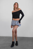 Woman wearing TIC TOC MSH30979-MADYEE ADYEE gingham bubble skirt with built-in shorts featuring a bubble hem silhouette, stretch elastic waistband, and easy pull-on fit for a playful western festival look.