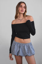 Woman wearing TIC TOC MSH30979-MADYEE ADYEE gingham bubble skirt with built-in shorts featuring a bubble hem silhouette, stretch elastic waistband, and easy pull-on fit for a playful western festival look.