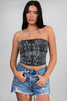 TIC TOC TA29069 BECKEE PU Vegan Leather Corset Top in distressed leather. Features a straight strapless neckline, rhinestone western detail, and lace-up back in color black. 