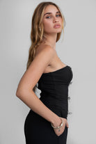 TIC TOC TA30224 KARMEN Strapless Corset Top with sheer center cutout and rhinestone bow embellishments.
