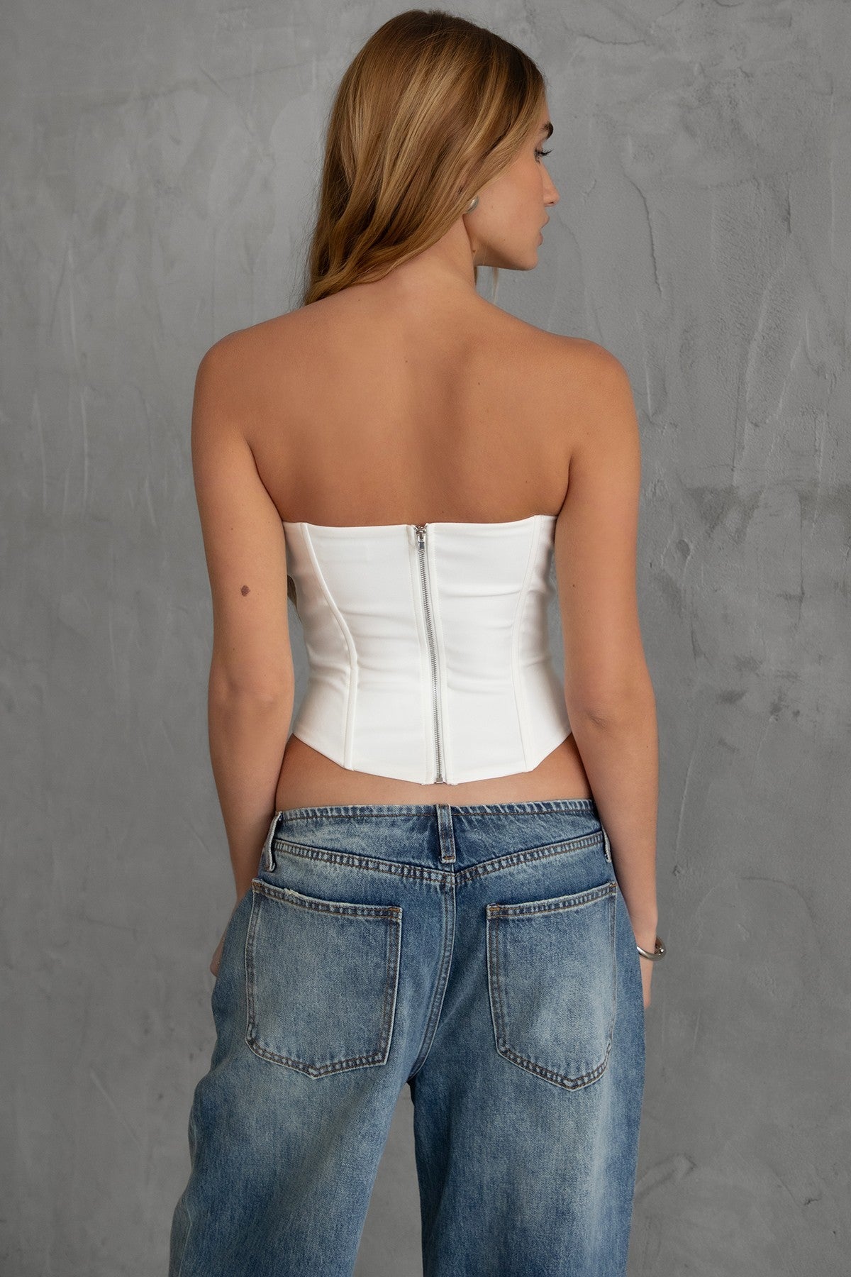 TIC TOC TA30224 KARMEN Strapless Corset Top with sheer center cutout and rhinestone bow embellishments.
