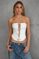 TIC TOC TA30224 KARMEN Strapless Corset Top with sheer center cutout and rhinestone bow embellishments.