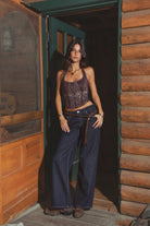 Full outfit with blue jeans styled on a wooden deck