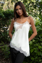 Woman wearing TIC TOC TA31968 SELINNE satin lace contrast V-neck cami top featuring smooth satin fabric, a flattering V neckline with scalloped lace trim, thin adjustable shoulder straps, and an asymmetrical lace-trim hem for a soft feminine date-night look.