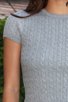 LAURENI Cable Knit Short Sleeve Top 
Cable Knit Baby Tee
High Crew Neckline 
Slim Fit Hip Length
Smooth Stretch Cable Knit Fabric