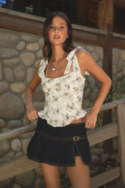 Woman wearing TIC TOC ROSALIEE Floral Eyelet Embroidered Top — front view showing self-tie straps and square neckline.