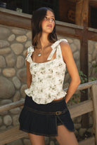 Woman wearing TIC TOC ROSALIEE Floral Eyelet Embroidered Top — front view showing self-tie straps and square neckline.