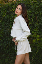 RICHI Classic Cropped Linen Blend Shirt
Linen collared long-sleeved button-up blouse
Pointed fold-over collar
Button front closure
Drop shoulders and button cuffs
Cropped Relaxed Fit
Made from breathable, lightweight linen blend fabric  
Perfect for lounging, summer vacations, or a European boho-inspired outfit. It can also serve as a stylish beach cover-up  
Matching bottom and top are sold separately, PA31288 