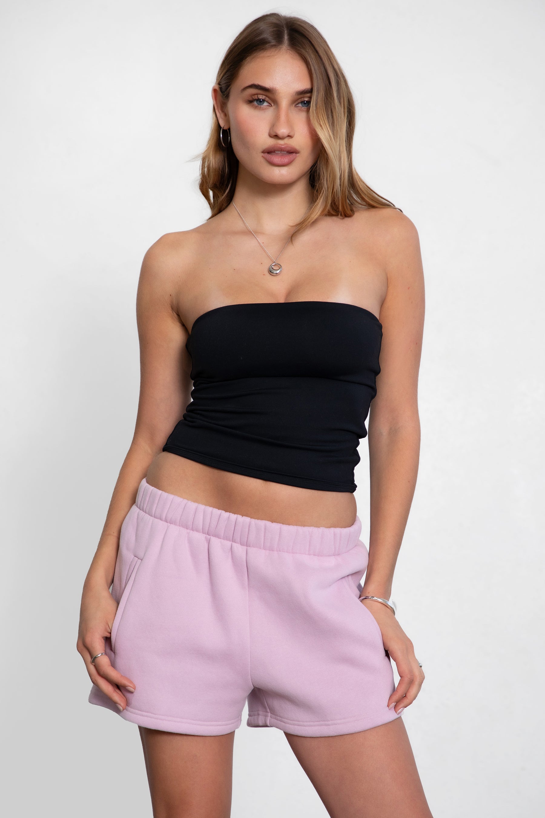 ZUZU Strapless Classic Tube Top 
Thick Smooth Fabric 
Flatters and Hugs The Curves 
Long Hip Length 
The Fabric Allows Stretch 