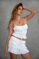 TIC TOC TH30766 RIRU Ruched Cami Top in lightweight rayon challis fabric. Features a square neckline, ruched tiered details, frill hem, and self-tie bust.