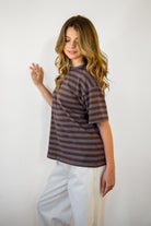 Woman wearing MARIN classic crewneck oversized striped short sleeve top featuring a timeless crew neckline, relaxed oversized fit, drop shoulder sleeves, soft horizontal stripe pattern, breathable 100% cotton fabric, and clean straight hem for everyday casual styling.