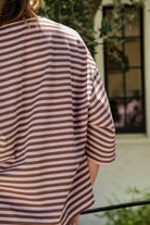 Woman wearing MARLOWE classic crewneck striped short sleeve top featuring a soft horizontal stripe pattern, relaxed semi oversized fit, drop shoulder short sleeves, lightweight stretch cotton blend, and clean straight hemline for casual lounge and coastal styling.