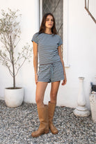 Woman wearing MARLOWE classic crewneck stripe short sleeve t-shirt featuring soft cotton blend fabric, lightweight comfortable feel, timeless striped pattern, classic crew neckline, short sleeves, relaxed slim fit, and effortless essential design for layering or everyday styling.