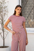 Woman wearing MARLOWE classic crewneck stripe short sleeve t-shirt featuring soft cotton blend fabric, lightweight comfortable feel, timeless striped pattern, classic crew neckline, short sleeves, relaxed slim fit, and effortless essential design for layering or everyday styling.