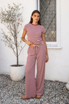 Woman wearing MARLOWE classic crewneck stripe short sleeve t-shirt featuring soft cotton blend fabric, lightweight comfortable feel, timeless striped pattern, classic crew neckline, short sleeves, relaxed slim fit, and effortless essential design for layering or everyday styling.