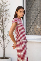 Woman wearing MARLOWE classic crewneck stripe short sleeve t-shirt featuring soft cotton blend fabric, lightweight comfortable feel, timeless striped pattern, classic crew neckline, short sleeves, relaxed slim fit, and effortless essential design for layering or everyday styling.