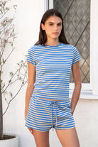 Woman wearing MARLOWE classic crewneck stripe short sleeve t-shirt featuring soft cotton blend fabric, lightweight comfortable feel, timeless striped pattern, classic crew neckline, short sleeves, relaxed slim fit, and effortless essential design for layering or everyday styling.