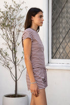 Woman wearing MARLOWE classic crewneck stripe short sleeve t-shirt featuring soft cotton blend fabric, lightweight comfortable feel, timeless striped pattern, classic crew neckline, short sleeves, relaxed slim fit, and effortless essential design for layering or everyday styling.