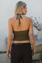 Woman wearing TIC TOC TC31322 KEZIA CREAM Mesh Sequin Embroidered Top with a brown capri pants 