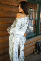AVERY Light Woodland Camo  Fleece Off The Shoulder Sweatshirt
Relaxed Off The Shoulder Construction 
Rib Knit Hem and Cuffs  
Light Forest Woodland Camo in Dusted Grey
Featured In Our New Cloud Fleece Fabric 
Back To School Western Rodeo Outfit Fashion Inspo

Cloud Fleece Key Features: 
Soft & Lightweight: Gentle on the skin with a breezy feel.
Midweight Warmth: Keeps you comfortable without overheating.
Drapey Design: Flows effortlessly for a flattering, laid-back look
