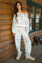 AVERY Light Woodland Camo  Fleece Off The Shoulder Sweatshirt
Relaxed Off The Shoulder Construction 
Rib Knit Hem and Cuffs  
Light Forest Woodland Camo in Dusted Grey
Featured In Our New Cloud Fleece Fabric 
Back To School Western Rodeo Outfit Fashion Inspo

Cloud Fleece Key Features: 
Soft & Lightweight: Gentle on the skin with a breezy feel.
Midweight Warmth: Keeps you comfortable without overheating.
Drapey Design: Flows effortlessly for a flattering, laid-back look
