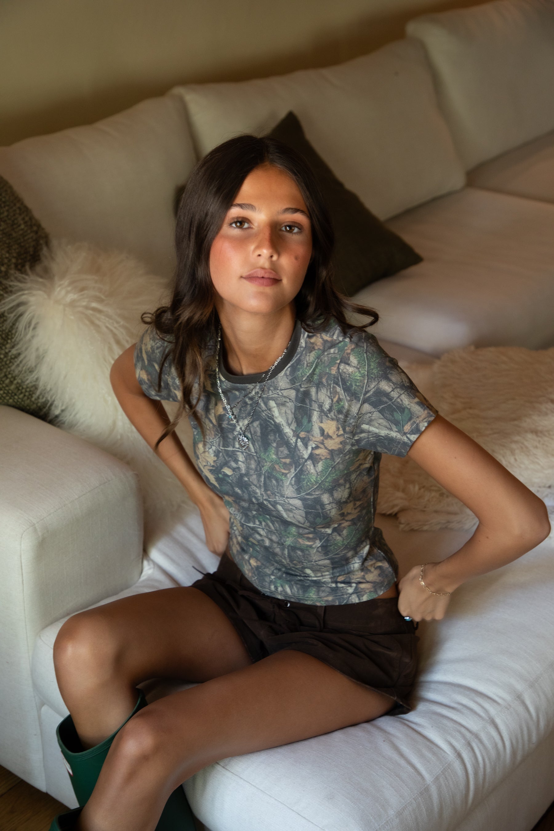 NOLA Woodland Camo Jersey Baby Tee 
Contrast High Round Neckline Short Sleeve Top 
Short Cap Sleeves
Smooth Bodyhugging Stretch Fabric
Elevated Lounge Basic Top To Match Fleece Collection
Forest Woodland Camo
Back To School Western Rodeo Outfit Fashion Inspo
