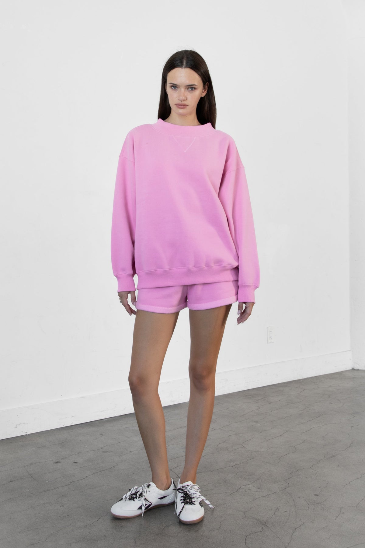Woman wearing LANI mock neck cloud fleece sweatshirt featuring soft cotton blend cloud fleece fabric, ribbed mock neckline, relaxed oversized fit, dropped shoulder design, long sleeves with ribbed cuffs, triangle stitch detail at center front, and ribbed hem for a cozy comfortable finish.