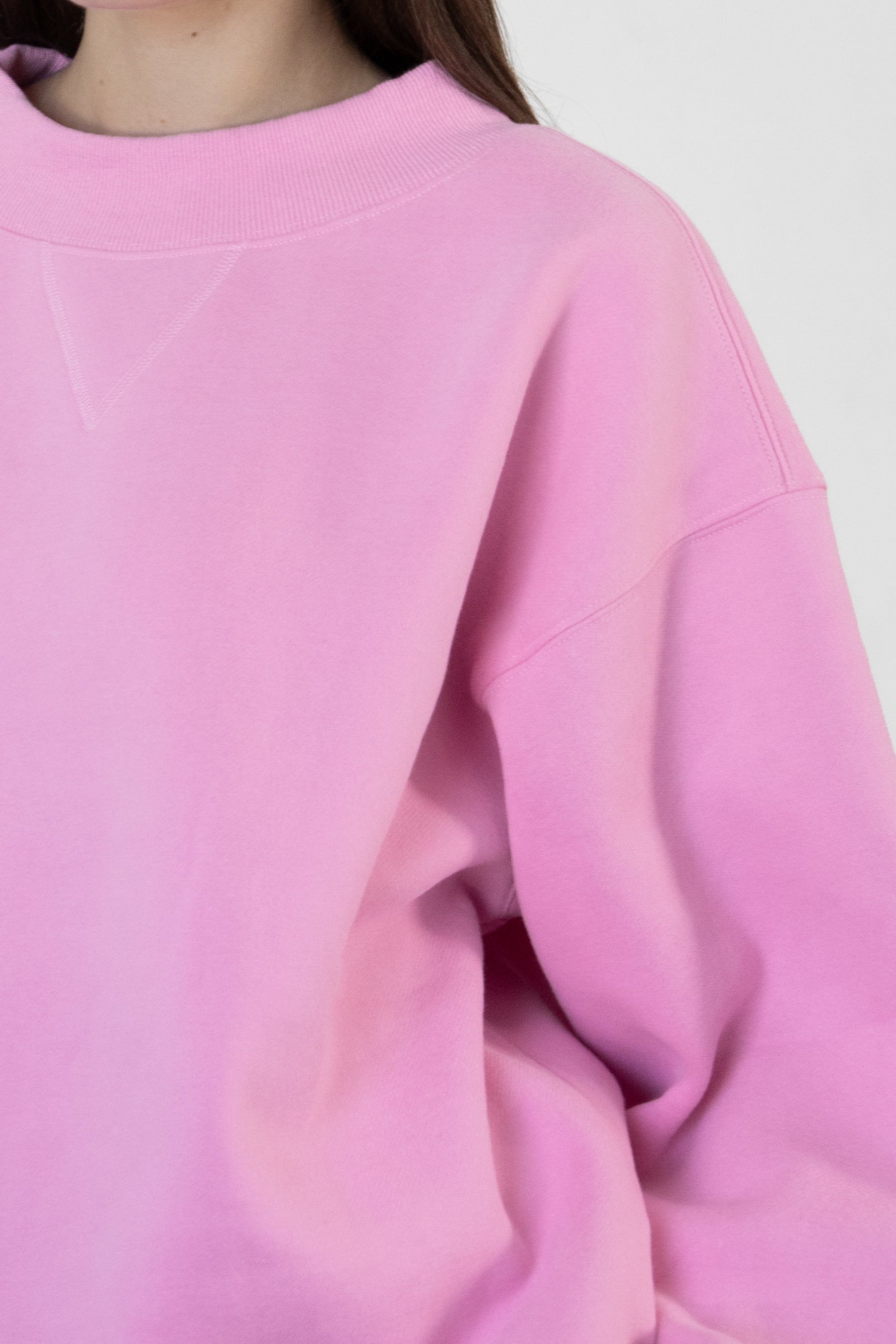 Woman wearing LANI mock neck cloud fleece sweatshirt featuring soft cotton blend cloud fleece fabric, ribbed mock neckline, relaxed oversized fit, dropped shoulder design, long sleeves with ribbed cuffs, triangle stitch detail at center front, and ribbed hem for a cozy comfortable finish.
