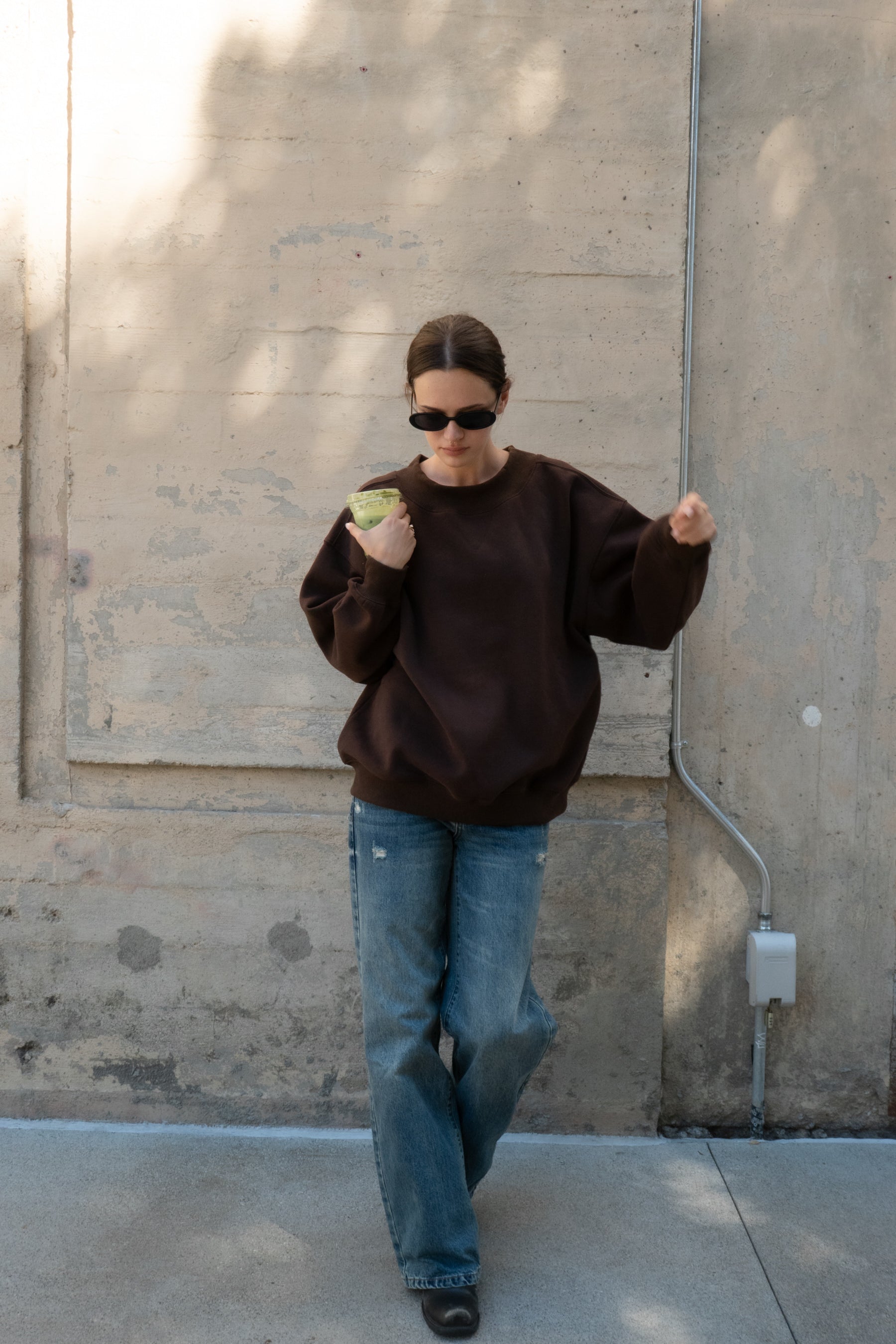 Woman wearing LANI mock neck cloud fleece sweatshirt featuring soft cotton blend cloud fleece fabric, ribbed mock neckline, relaxed oversized fit, dropped shoulder design, long sleeves with ribbed cuffs, triangle stitch detail at center front, and ribbed hem for a cozy comfortable finish.