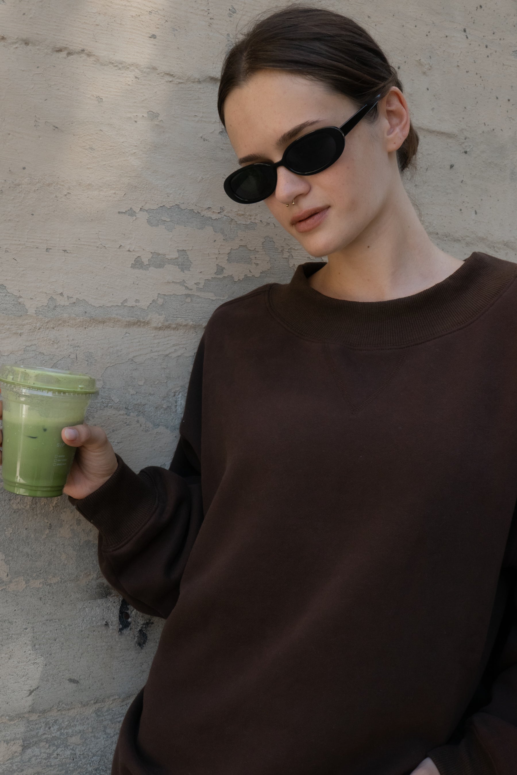 Woman wearing LANI mock neck cloud fleece sweatshirt featuring soft cotton blend cloud fleece fabric, ribbed mock neckline, relaxed oversized fit, dropped shoulder design, long sleeves with ribbed cuffs, triangle stitch detail at center front, and ribbed hem for a cozy comfortable finish.