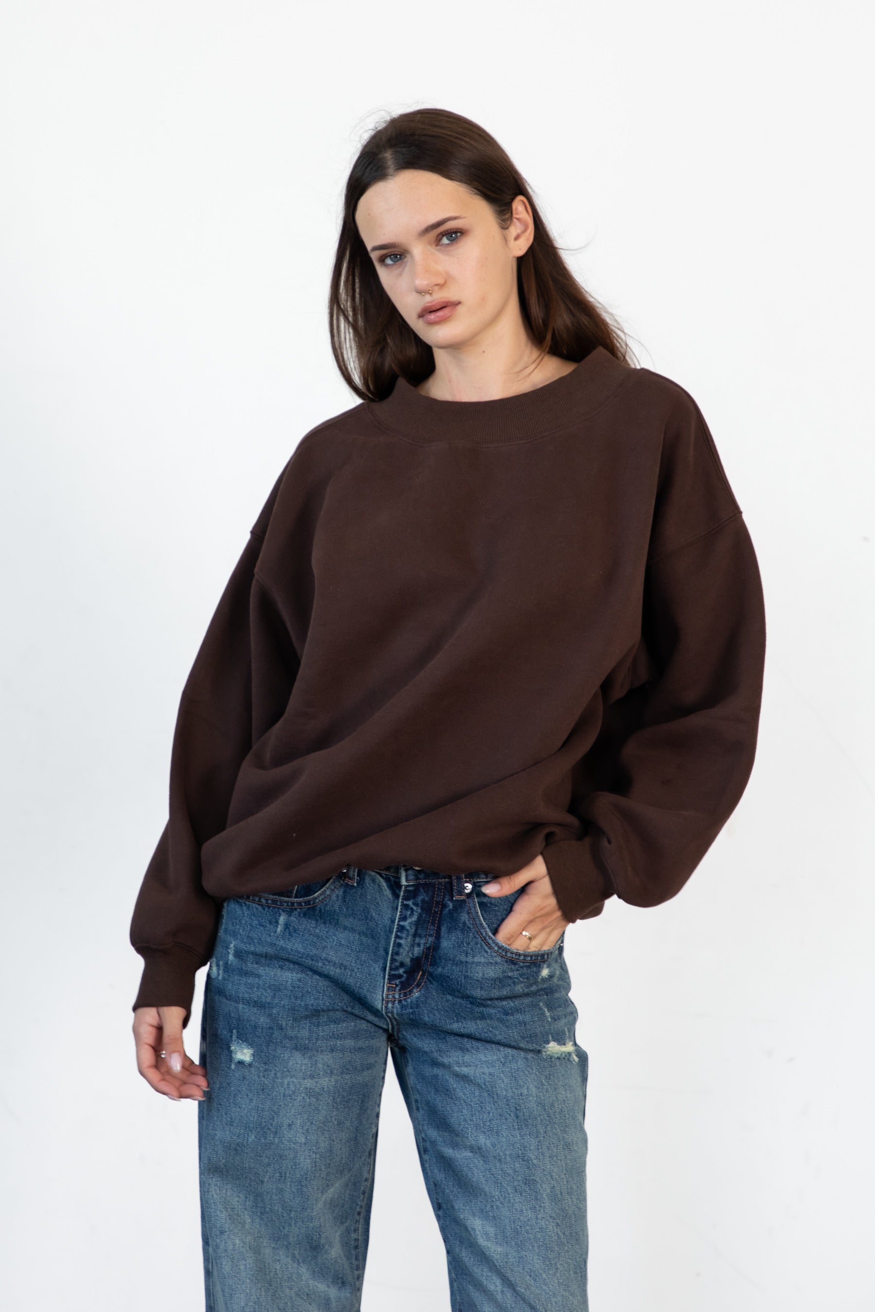 Woman wearing LANI mock neck cloud fleece sweatshirt featuring soft cotton blend cloud fleece fabric, ribbed mock neckline, relaxed oversized fit, dropped shoulder design, long sleeves with ribbed cuffs, triangle stitch detail at center front, and ribbed hem for a cozy comfortable finish.