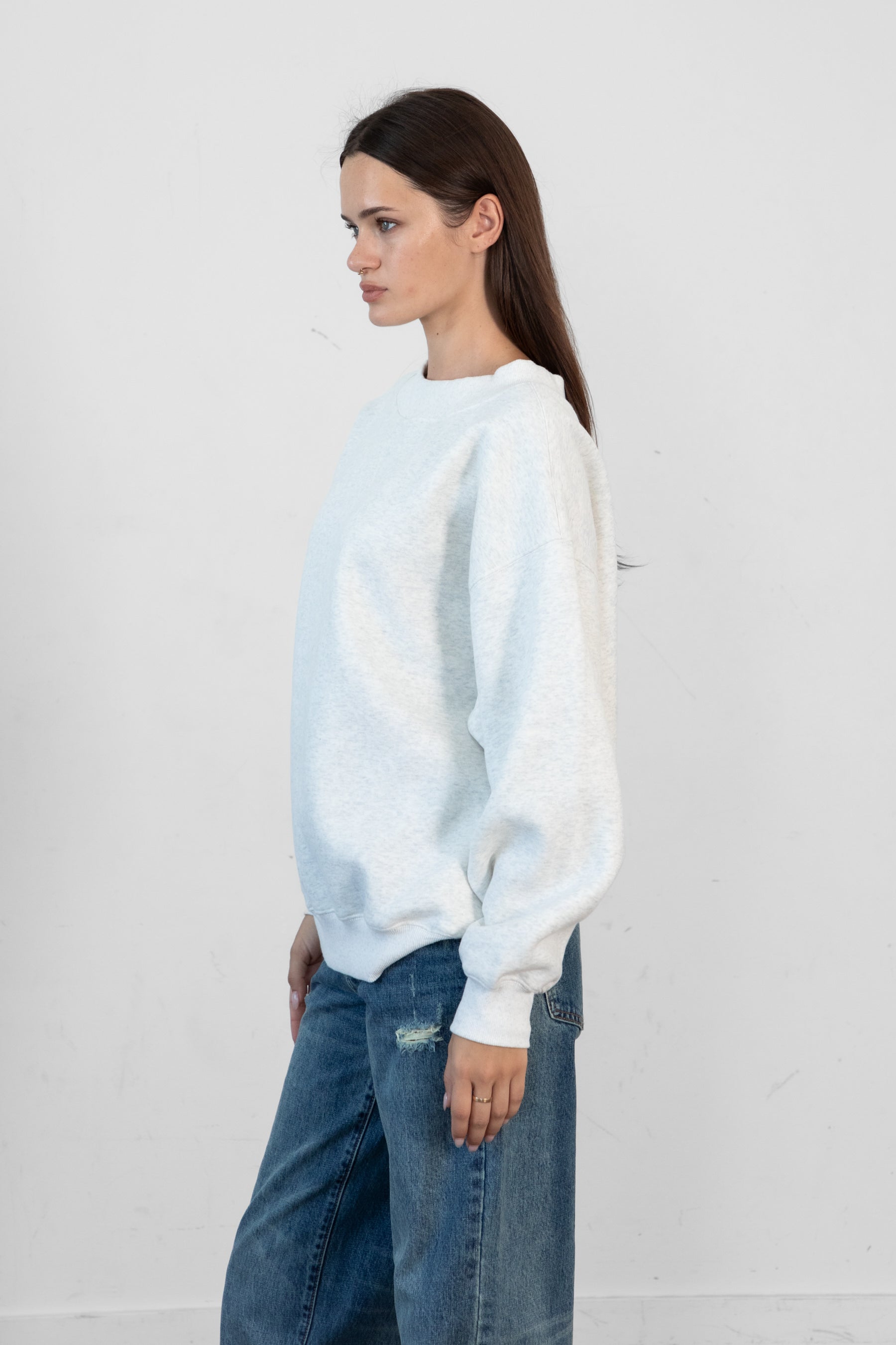 Woman wearing LANI mock neck cloud fleece sweatshirt featuring soft cotton blend cloud fleece fabric, ribbed mock neckline, relaxed oversized fit, dropped shoulder design, long sleeves with ribbed cuffs, triangle stitch detail at center front, and ribbed hem for a cozy comfortable finish.
